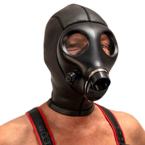 Person wearing a black gas mask with red straps on a white background